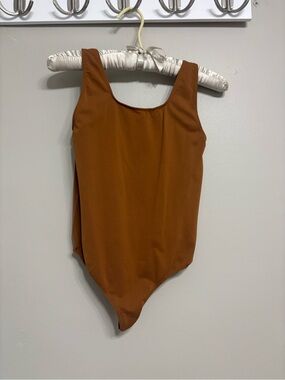 Skims soft smoothing thong bodysuit in copper. Women’s size medium